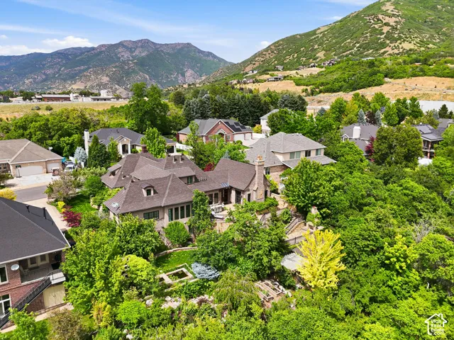 Expansive residence with a multi-gabled roofline and stone exterior accents