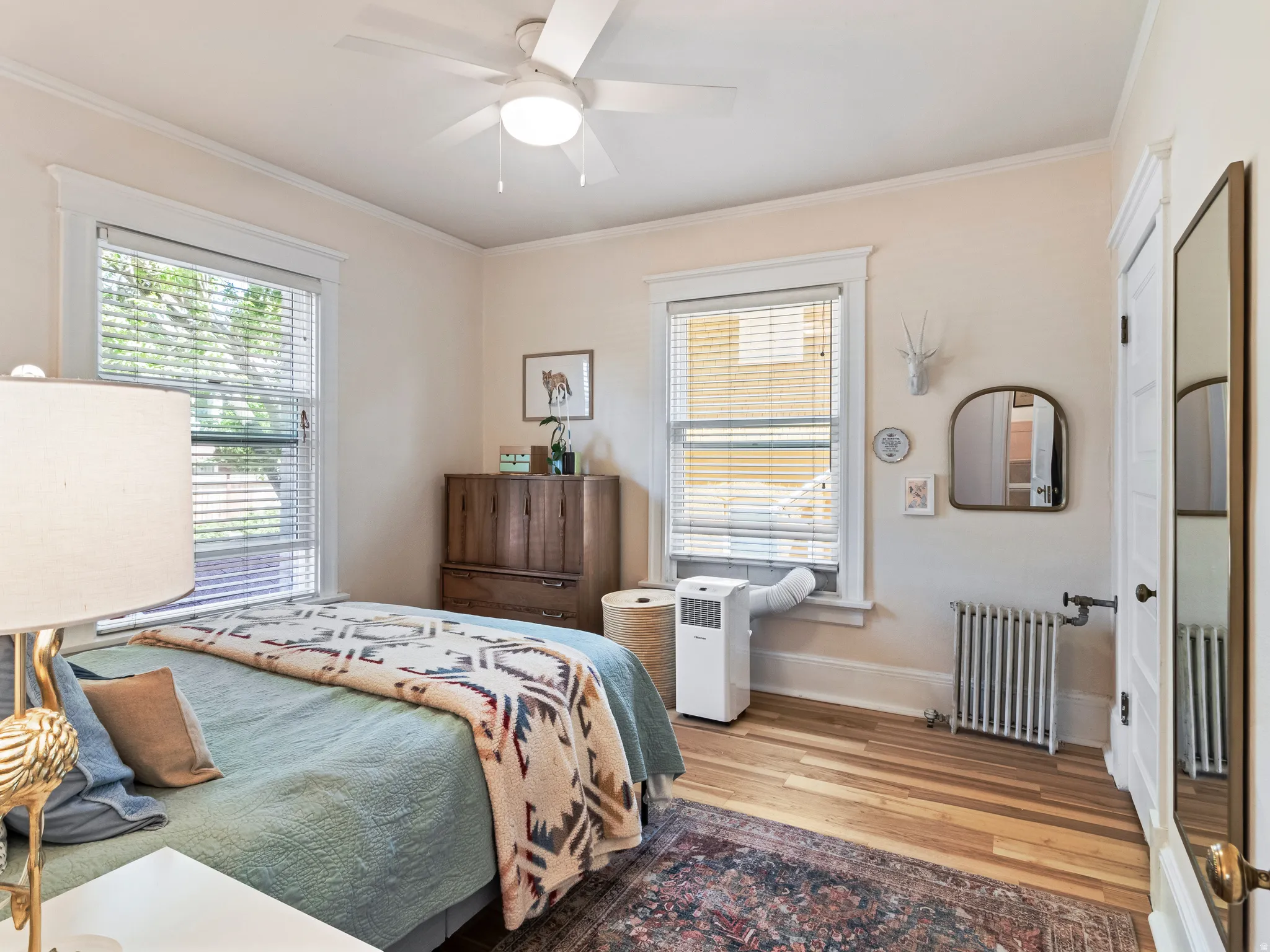 Hardwood-style flooring and light-toned walls create a bright interior