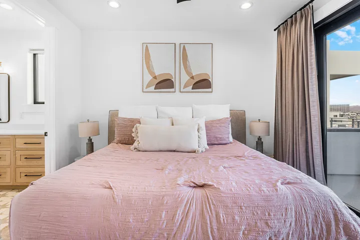Bright bedroom featuring recessed lighting, a built-in ceiling fan, and a floor-to-ceiling glass door providing outdoor access