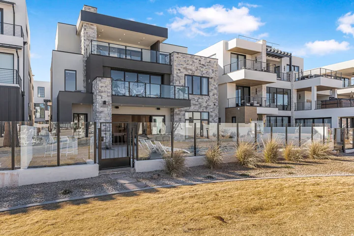 Contemporary multi-story exterior with stone and stucco accents