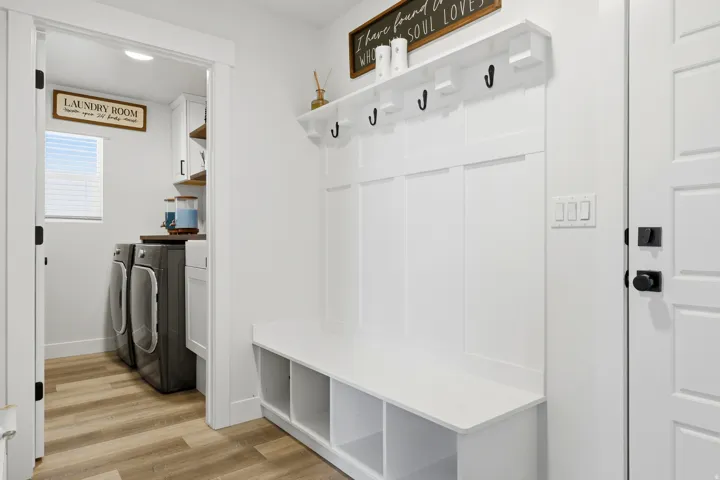 White board and batten wall with an integrated bench and cubby storage