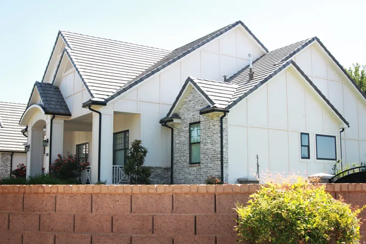 Modern farmhouse exterior featuring white board and batten siding with contrasting dark trim