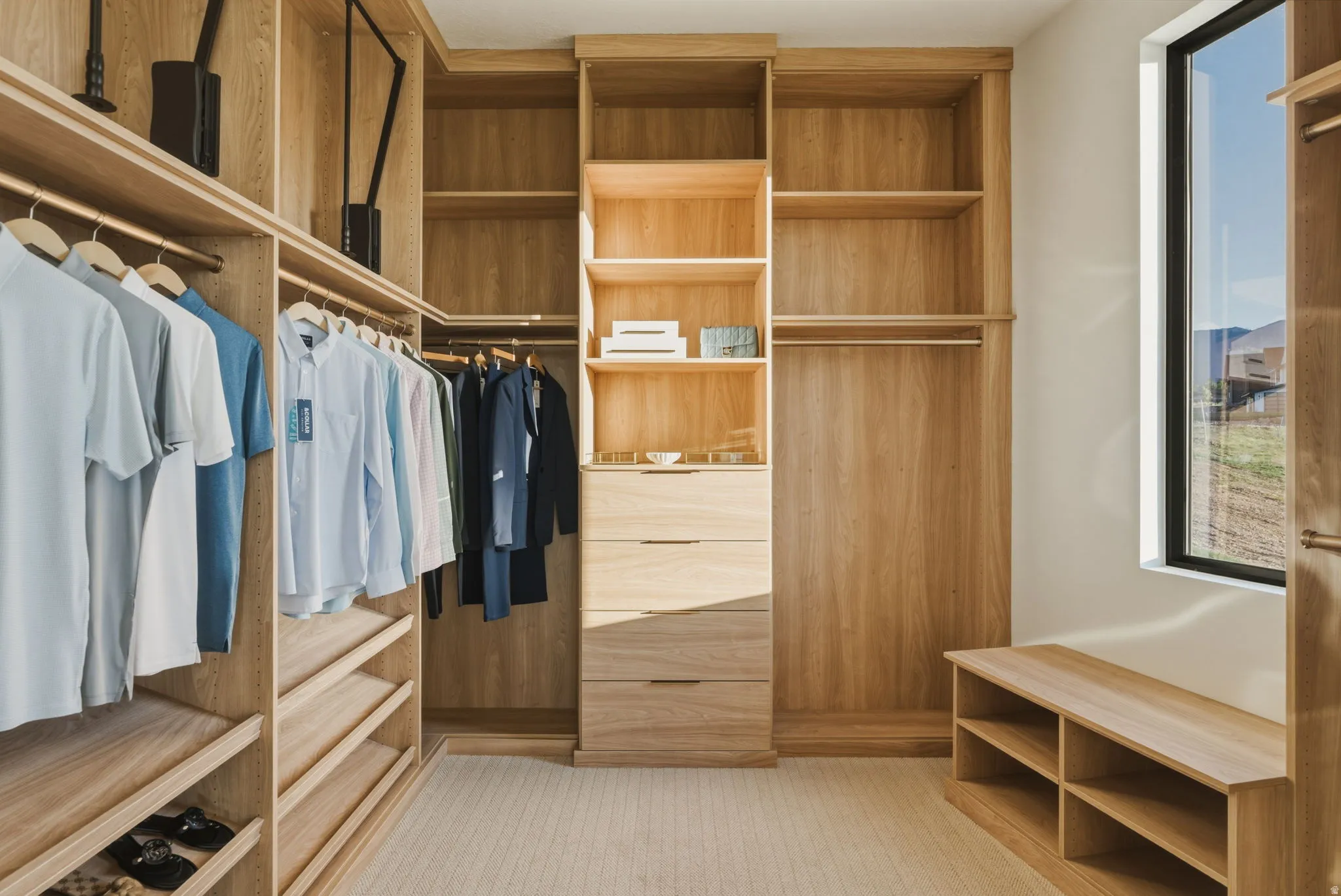 Custom wood-finish closet system featuring integrated shelving, multiple hanging rods, and built-in drawers