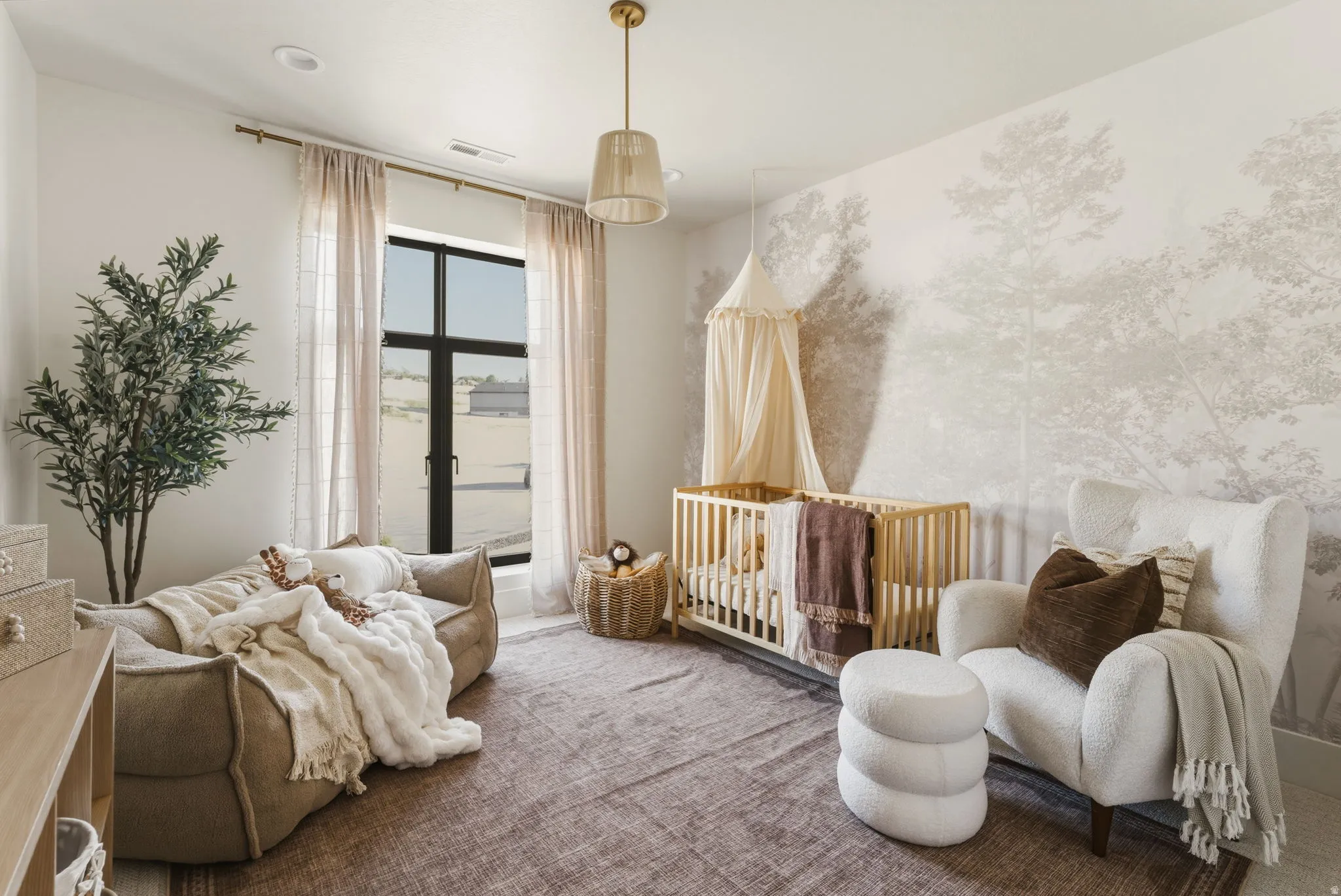 Room featuring a large window with floor-length drapes, a unique patterned accent wall, and recessed ceiling lighting