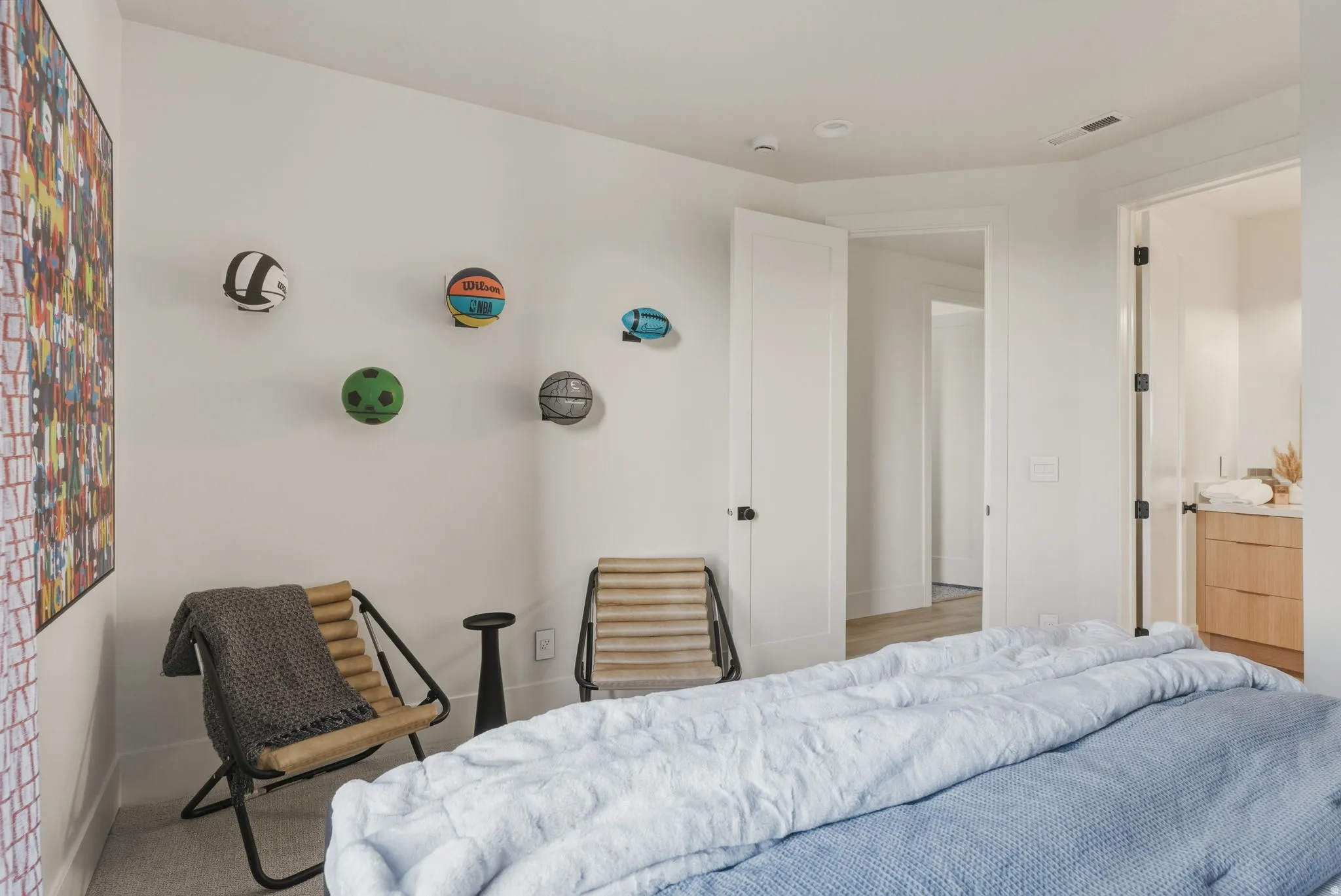 White walls with recessed lighting and light-colored carpeting