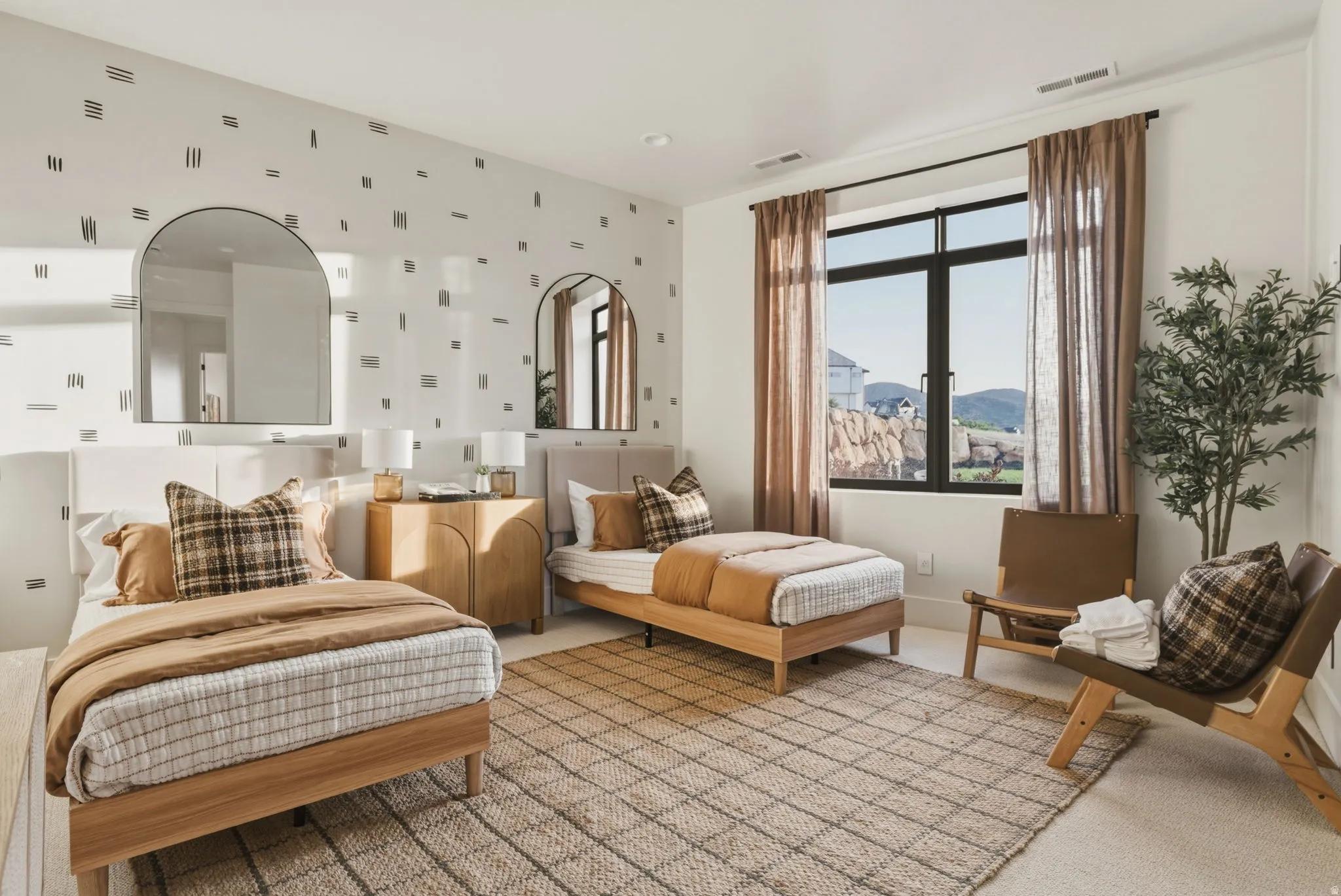 Bright room featuring a large black-framed window, patterned accent wall, and recessed lighting