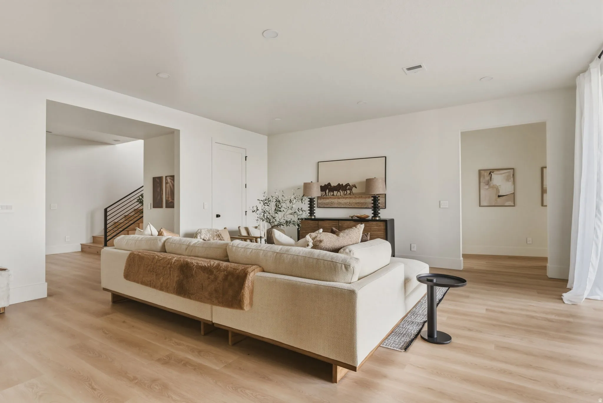 Bright interior space featuring light wood-finish flooring