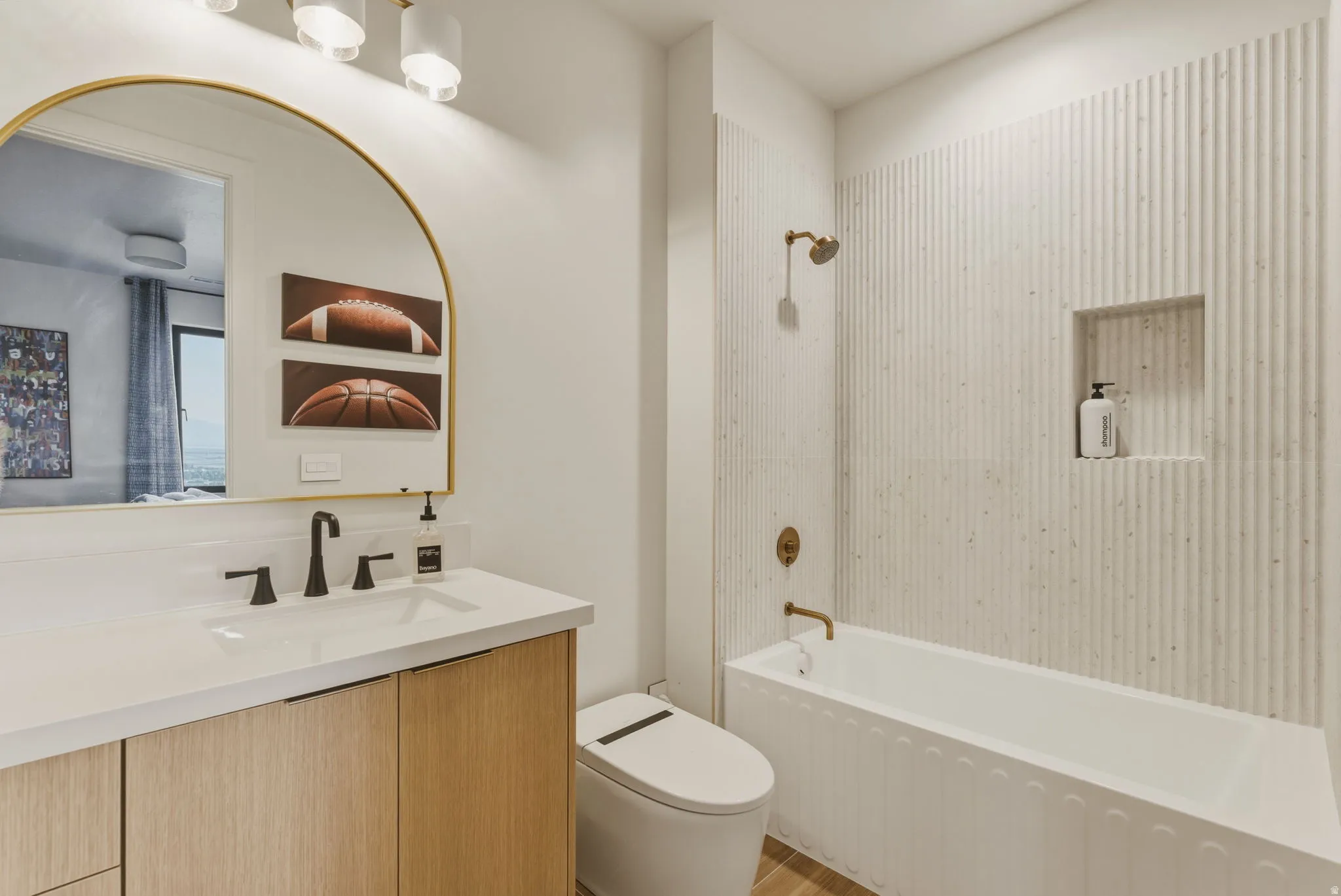 Contemporary bathroom featuring a wood-finish vanity with a white countertop and rectangular undermount sink
