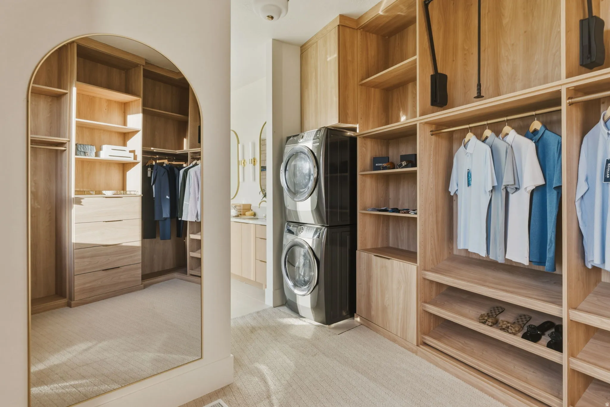 Integrated laundry appliances within a custom wood-finish closet system