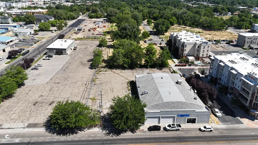 Commercial building with an arched roofline, two garage bays, and a street-facing entrance