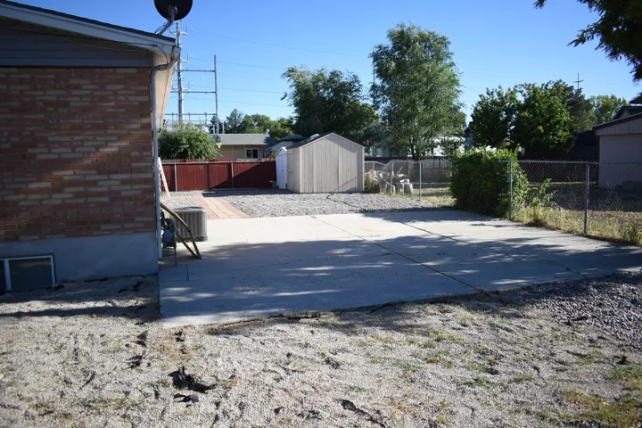 Expansive concrete patio with an additional brick paver section