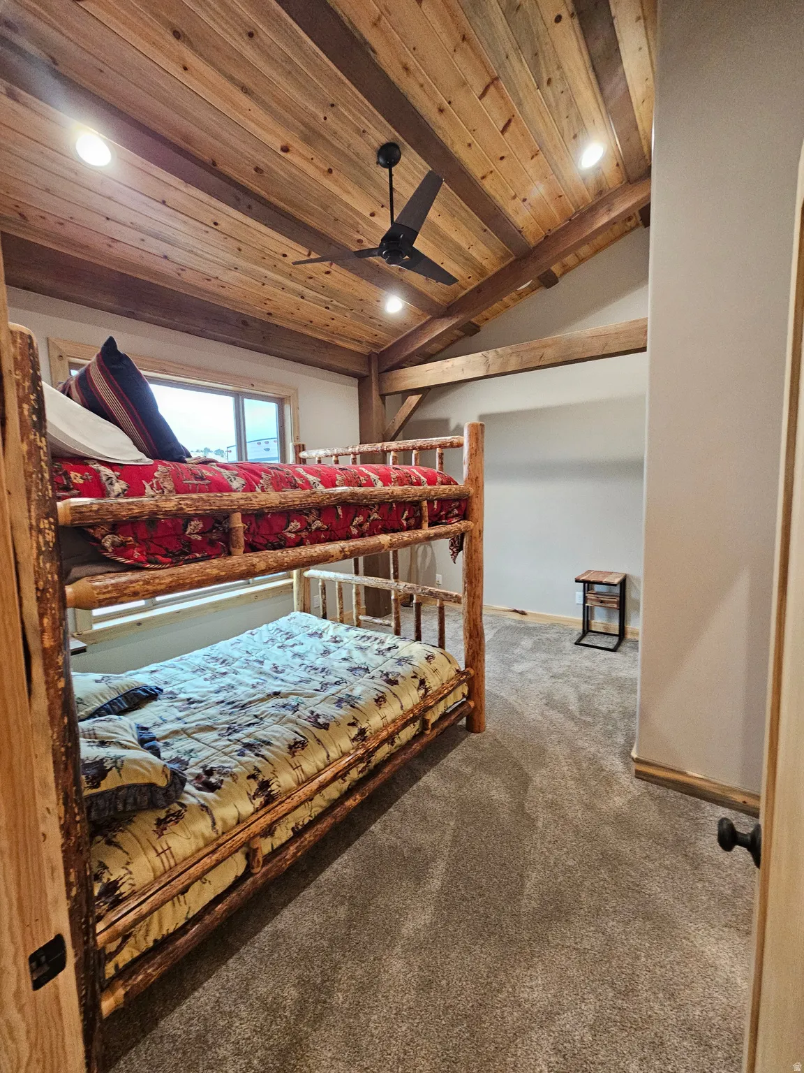 Bedroom with vaulted wood ceiling with exposed beams, recessed lighting, and a ceiling fan