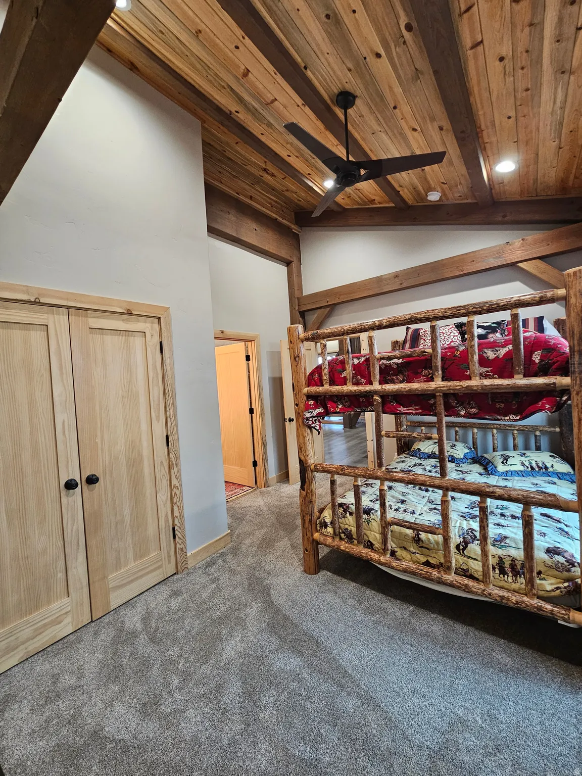 Bedroom with vaulted wood ceiling with exposed beams, recessed lighting, and a ceiling fan