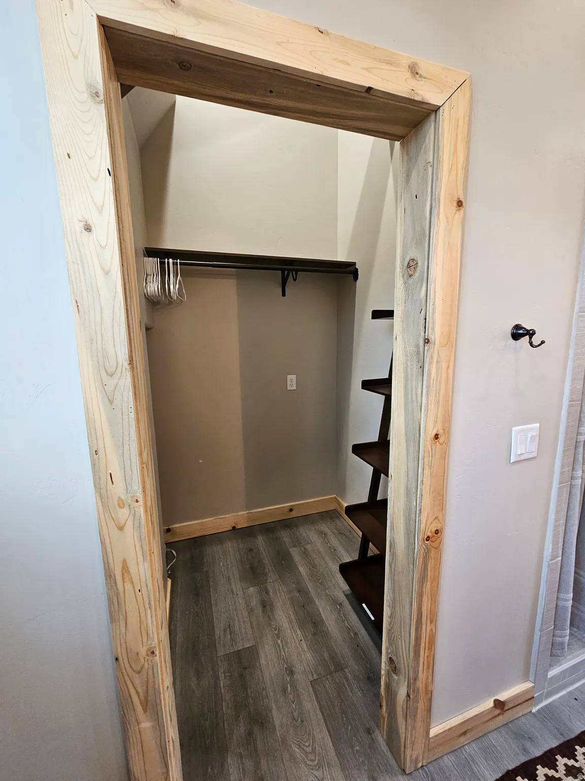 Large Closet space featuring light wood-finish trim