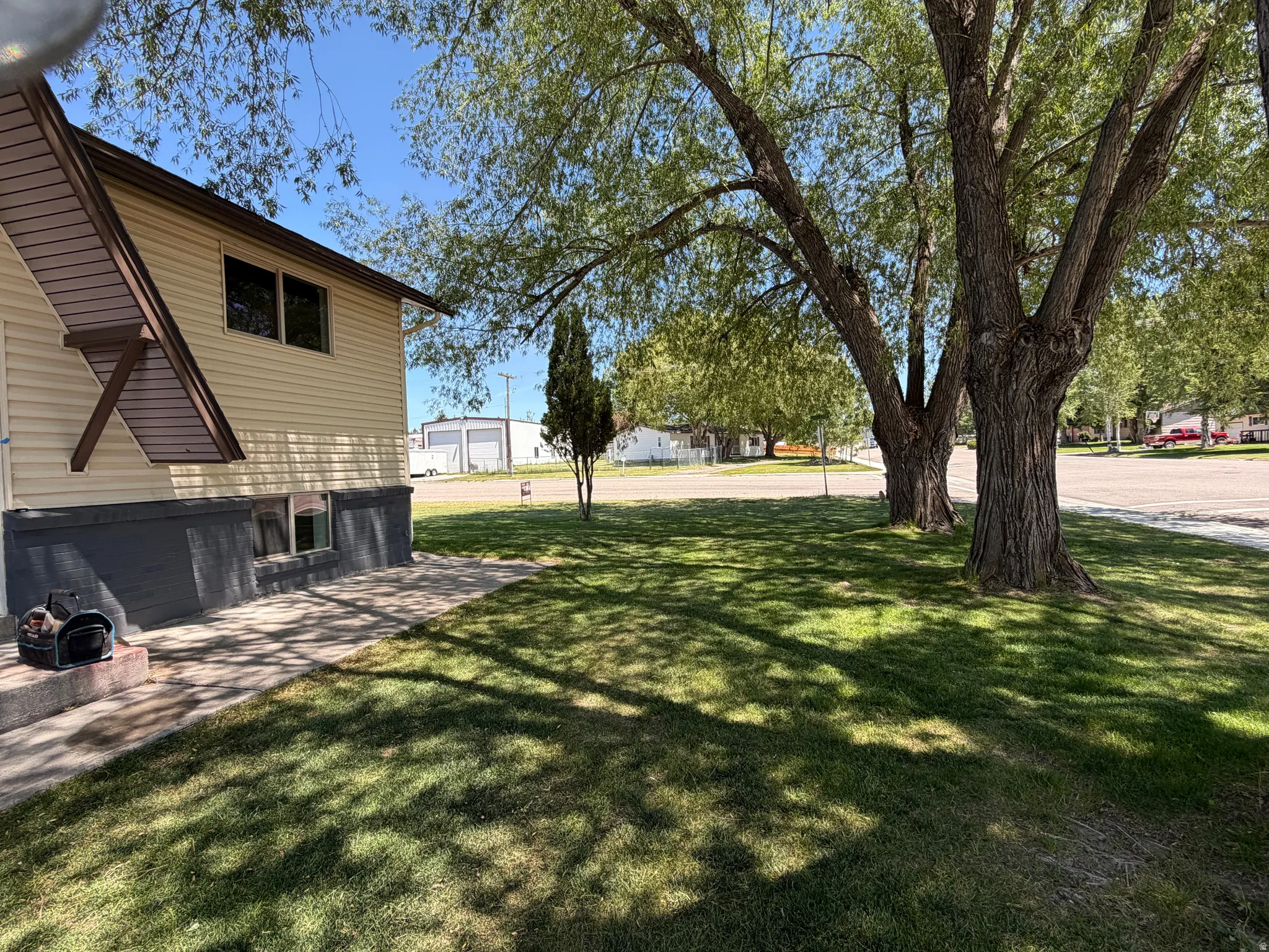 Established landscaping with mature trees providing ample shade
