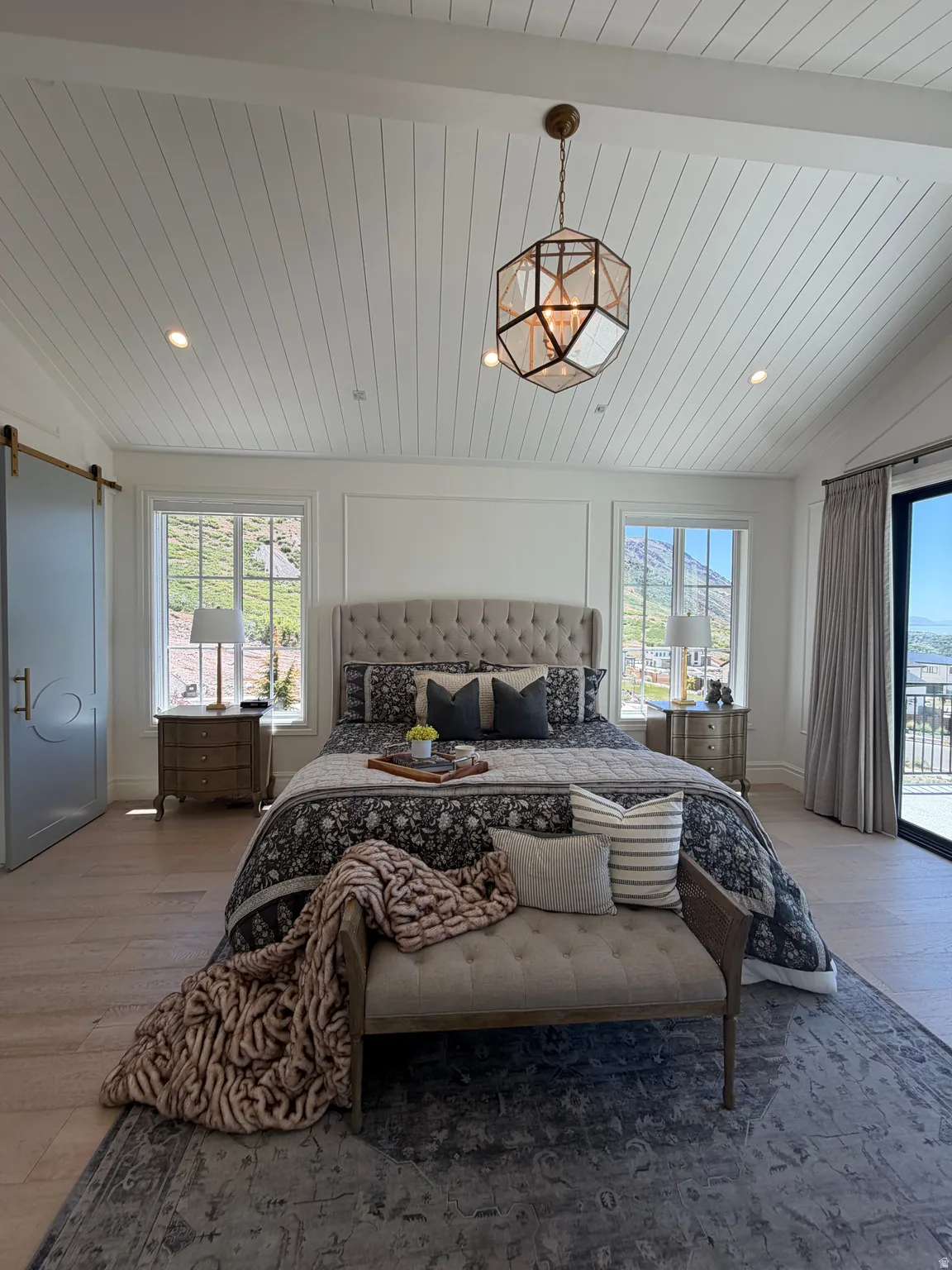 Vaulted shiplap ceiling featuring a geometric pendant light and recessed lighting