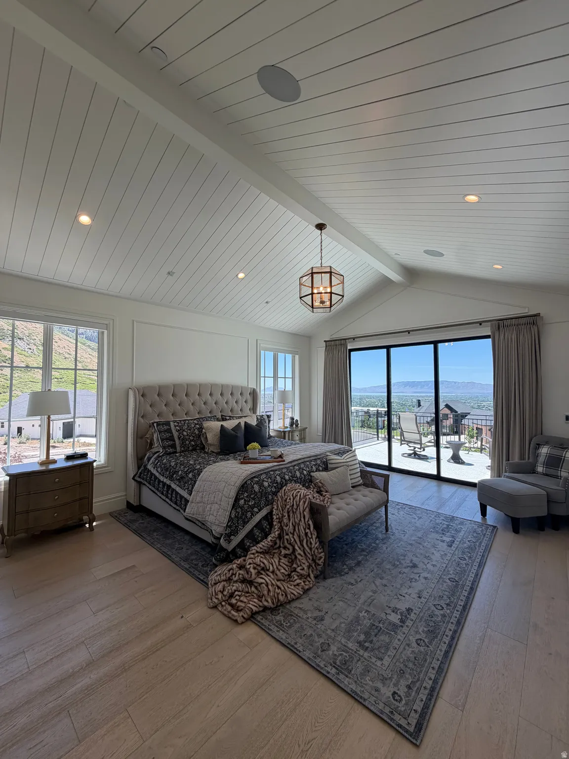 Vaulted shiplap ceiling featuring recessed lighting and a central chandelier
