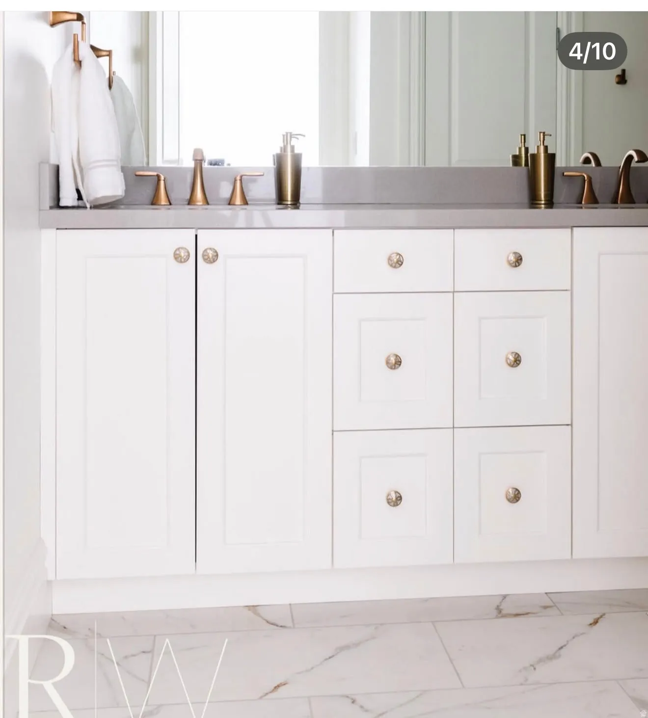 Dual vanity with white cabinetry and a gray countertop