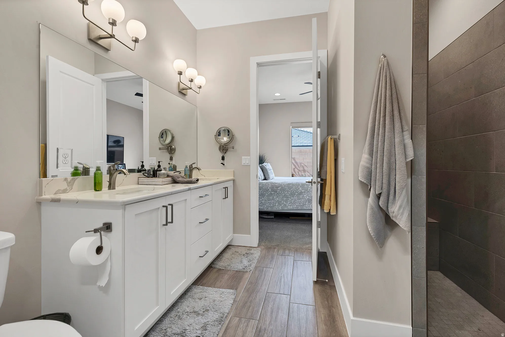 Dual vanity with a white countertop and rectangular undermount sinks