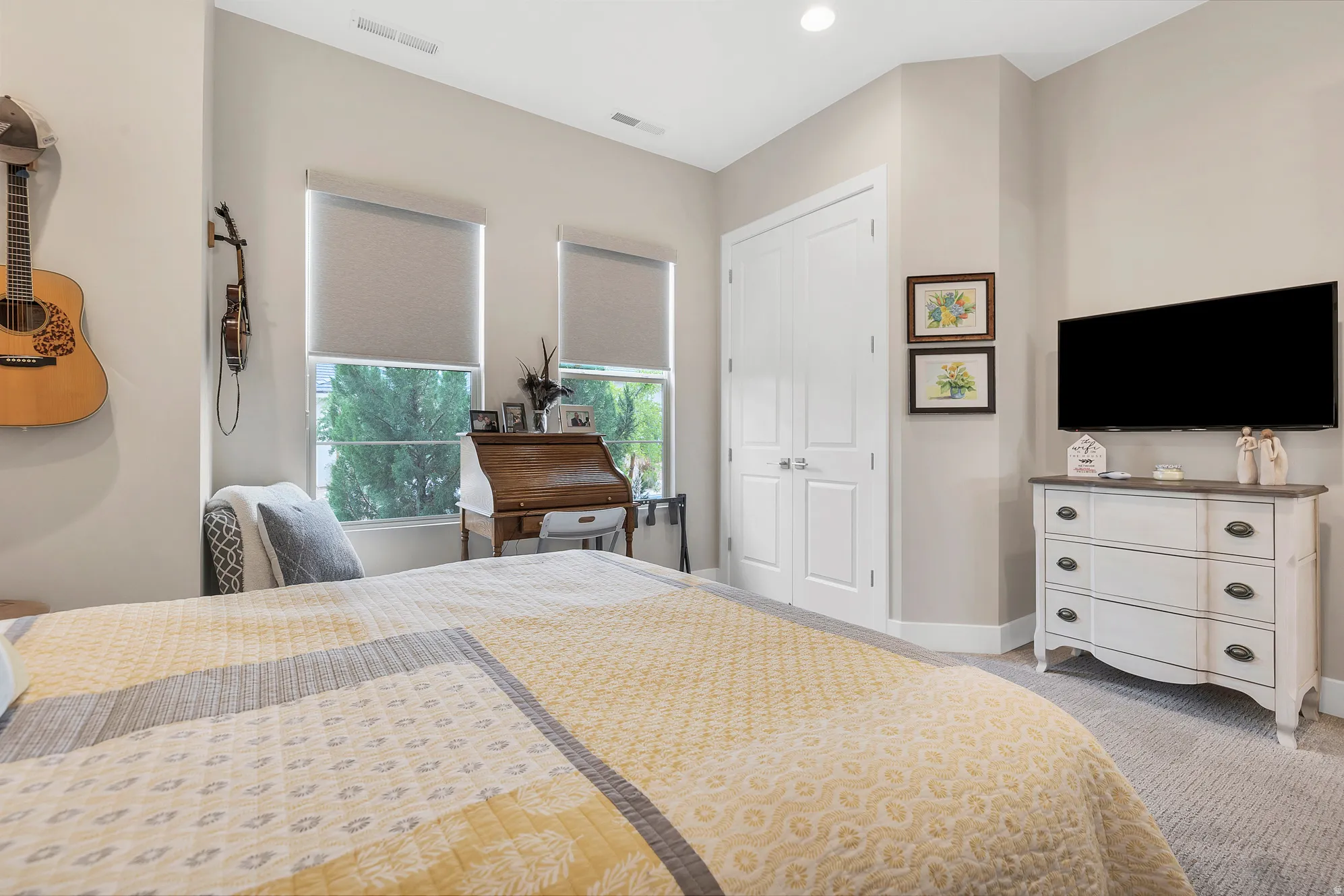 Spacious room featuring neutral-toned walls, recessed lighting, and carpet flooring