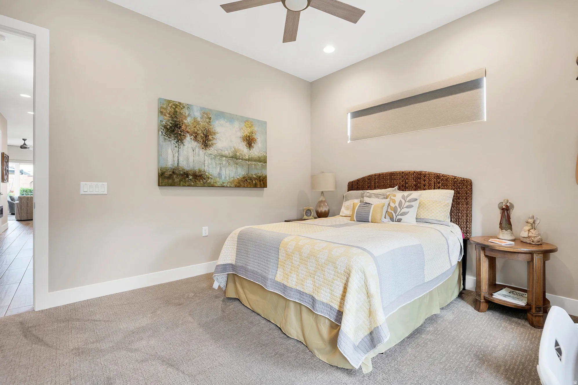 Bedroom featuring neutral carpeting, a ceiling fan, recessed lighting, and a horizontal window with a roller shade