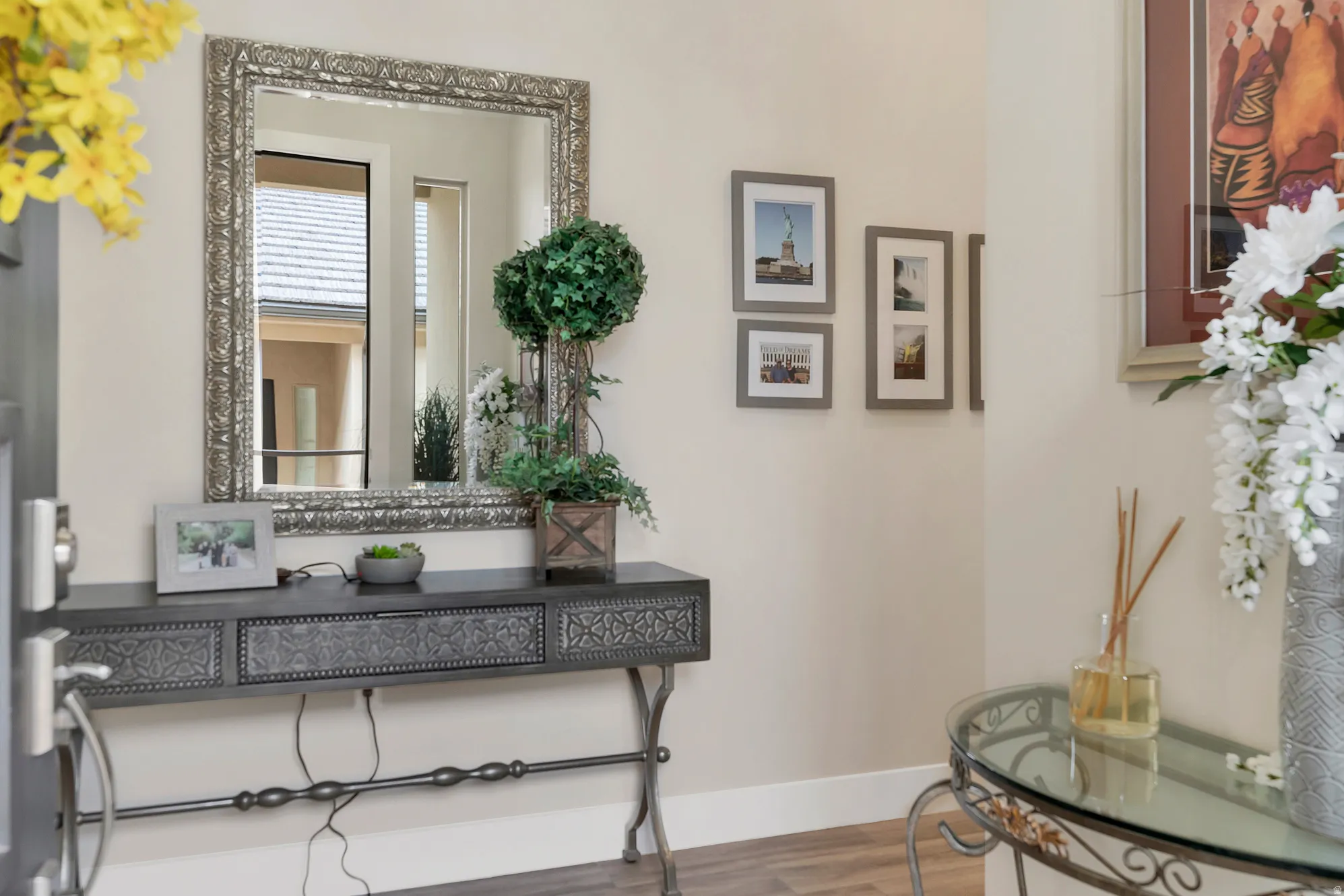 Entryway featuring a decorative console table with an ornate mirror above