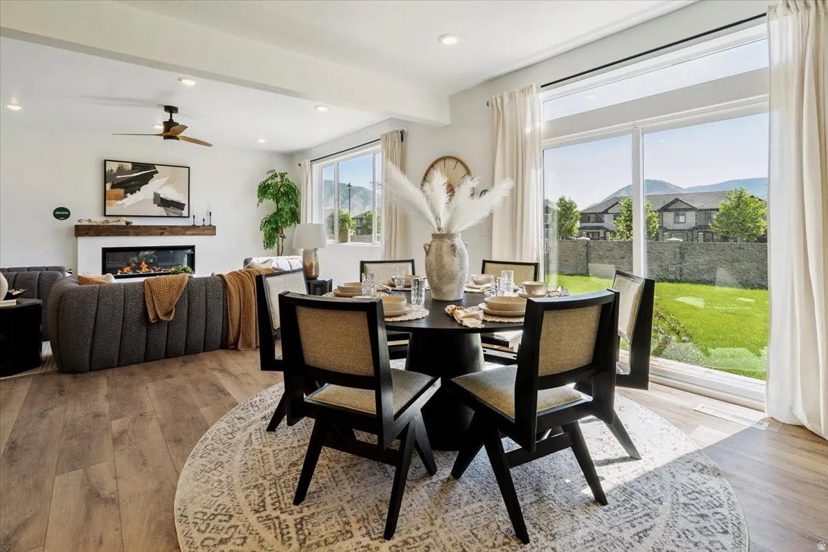 Open concept interior featuring wide plank wood-finish flooring