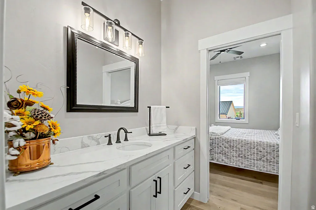 Double vanity with an undermount sink, quartz countertop, and matte black fixtures