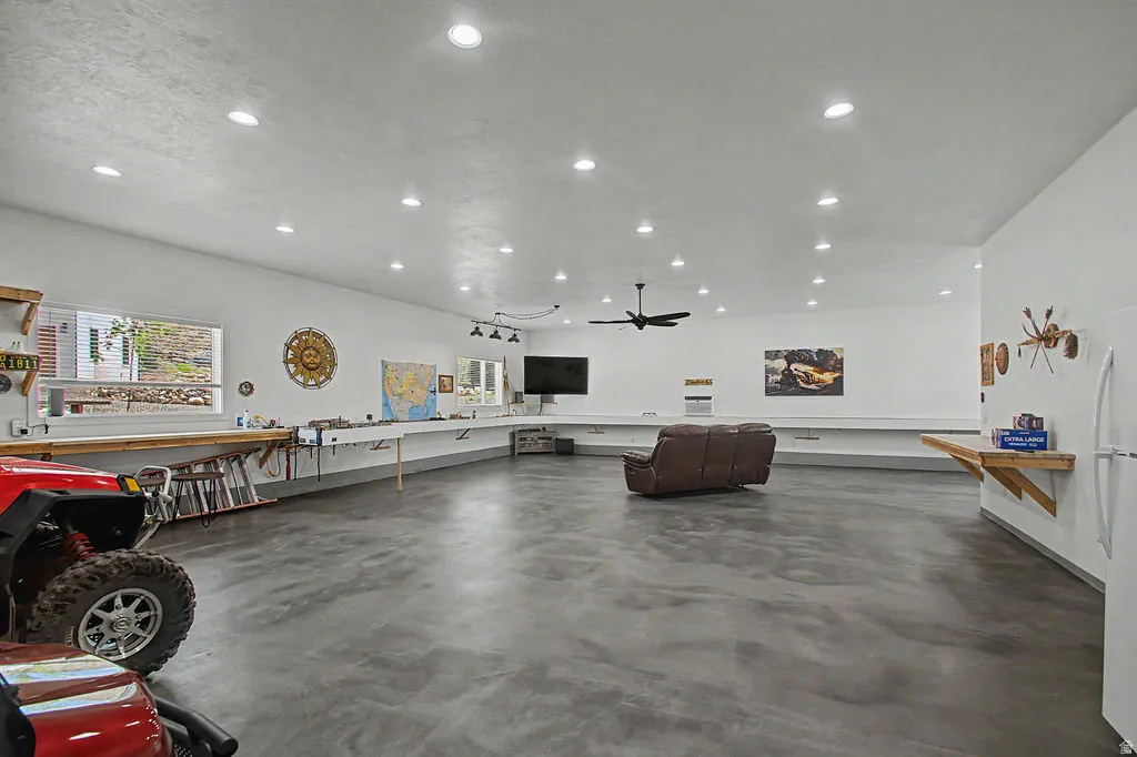 Spacious multi-purpose detached shop featuring a polished concrete floor and recessed ceiling lighting