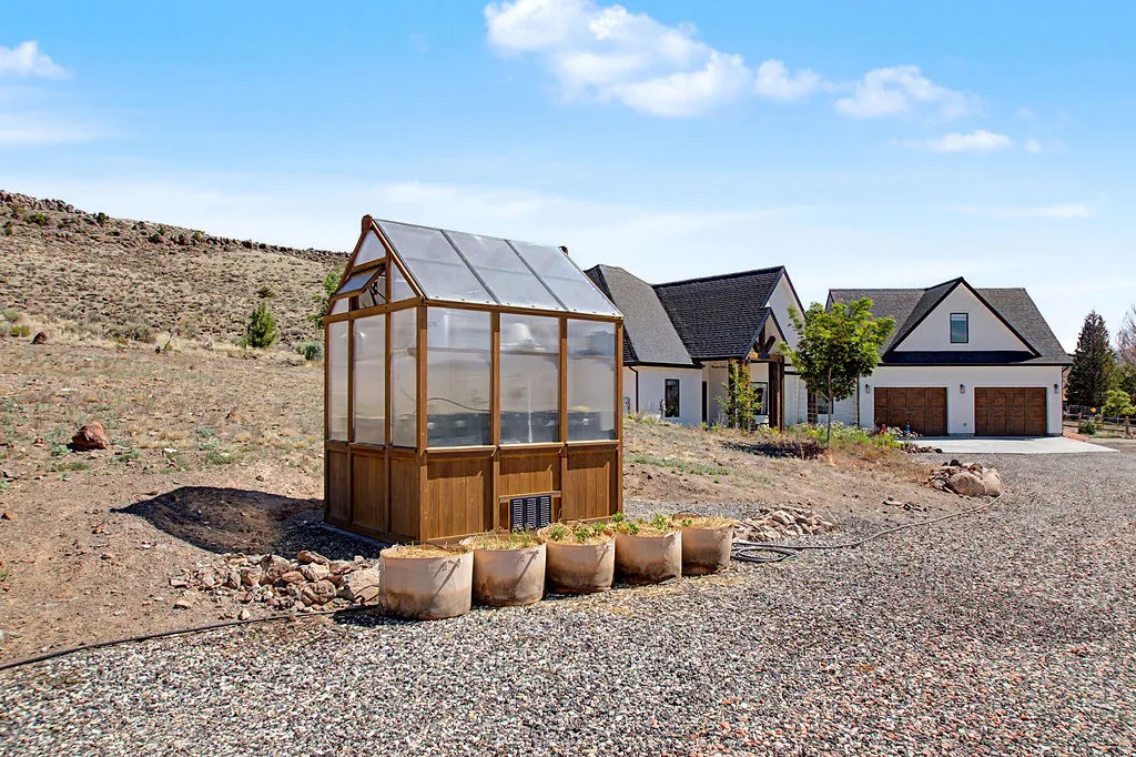 Wood-frame greenhouse with transparent paneling