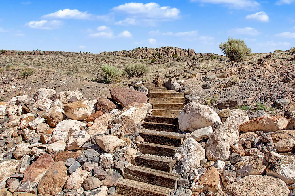 Natural rock and arid landscape featuring built-in timber steps