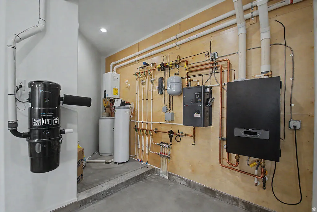 In the attached garage dedicated utility room featuring comprehensive mechanical systems