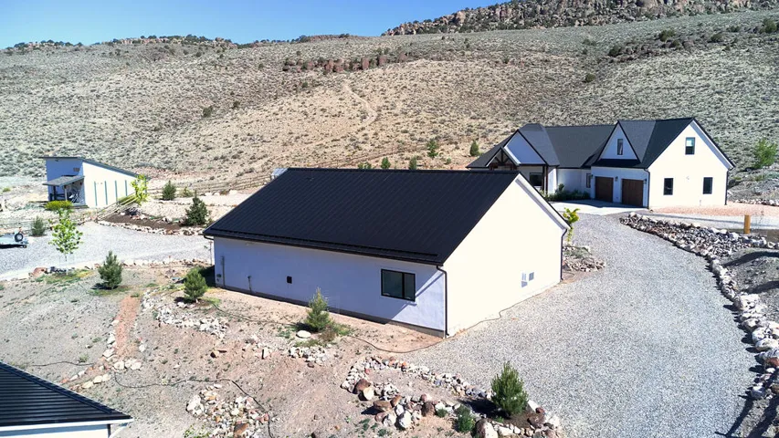 Circular gravel driveway allowing easy access to property.