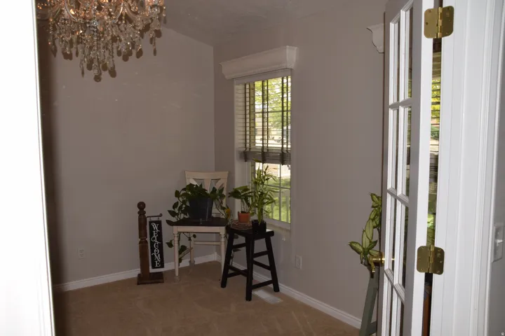 Recessed window with wood-finish blinds and decorative valance