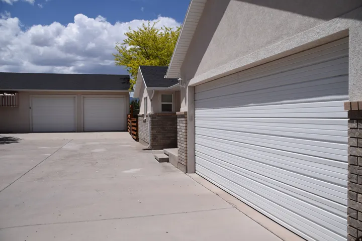 Multi-car concrete driveway providing access to two separate garages