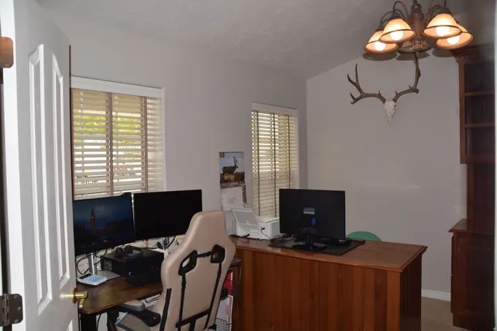 Room featuring light gray walls and wood-finish flooring