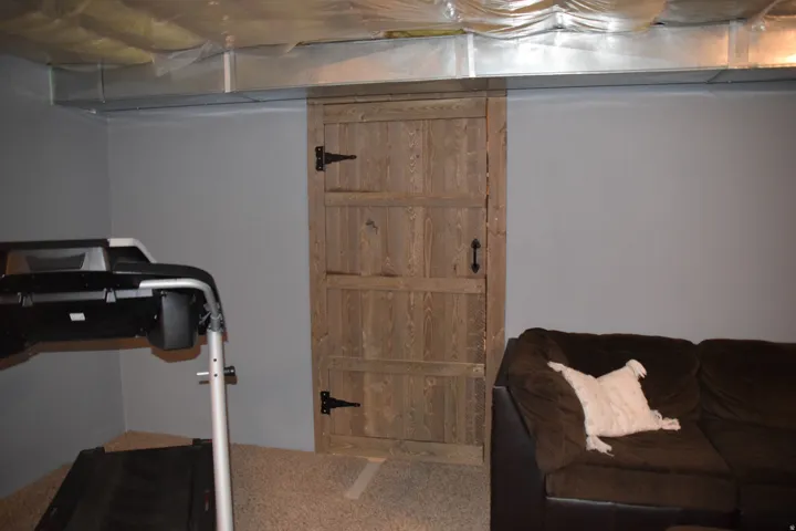 Reclaimed wood-finish door with black hardware
