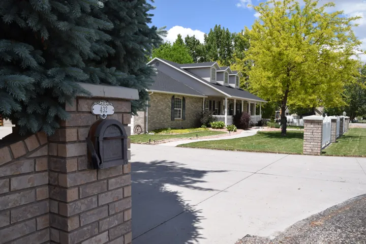Brick columns featuring a built-in mailbox and house number