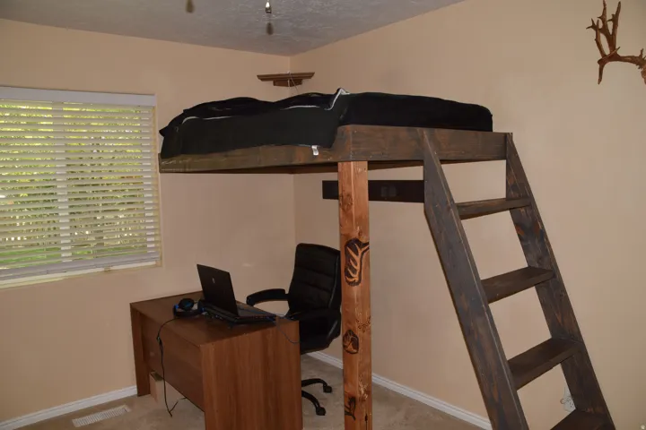 Wood-finish loft bed structure with an integrated ladder