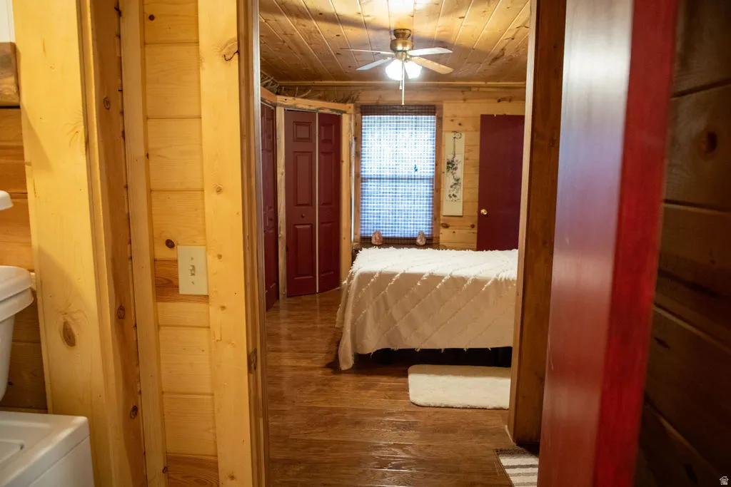 Interior room featuring wood-finish wall and ceiling panels