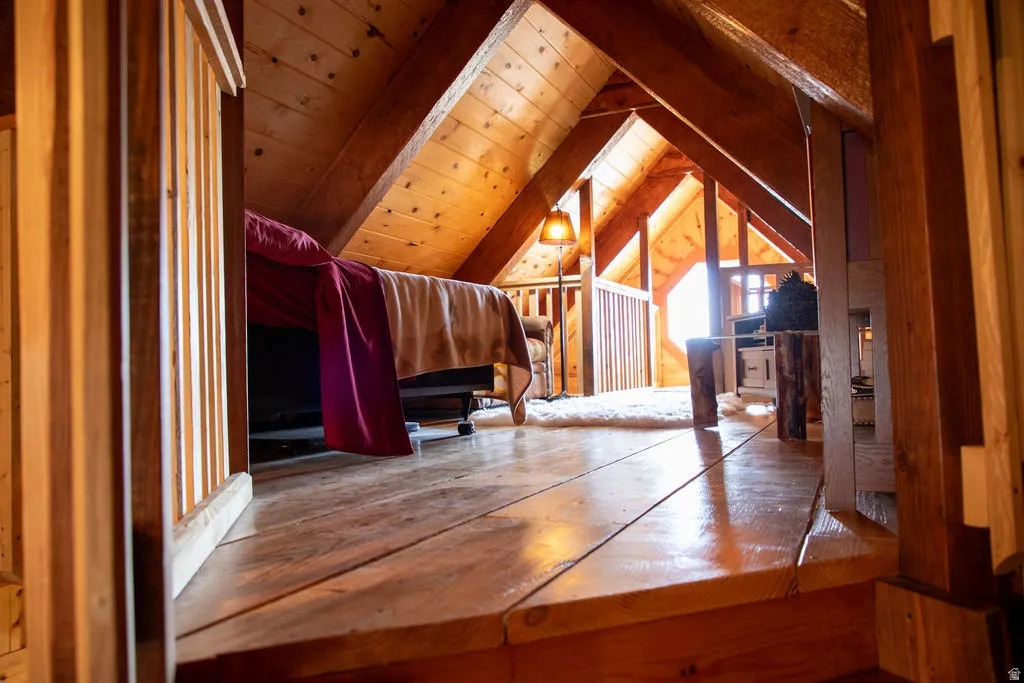 Vaulted wood-paneled ceiling with exposed beams