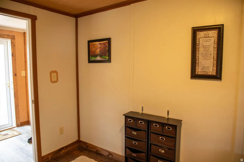 Light wood-finish paneling ceiling with exposed wood beams