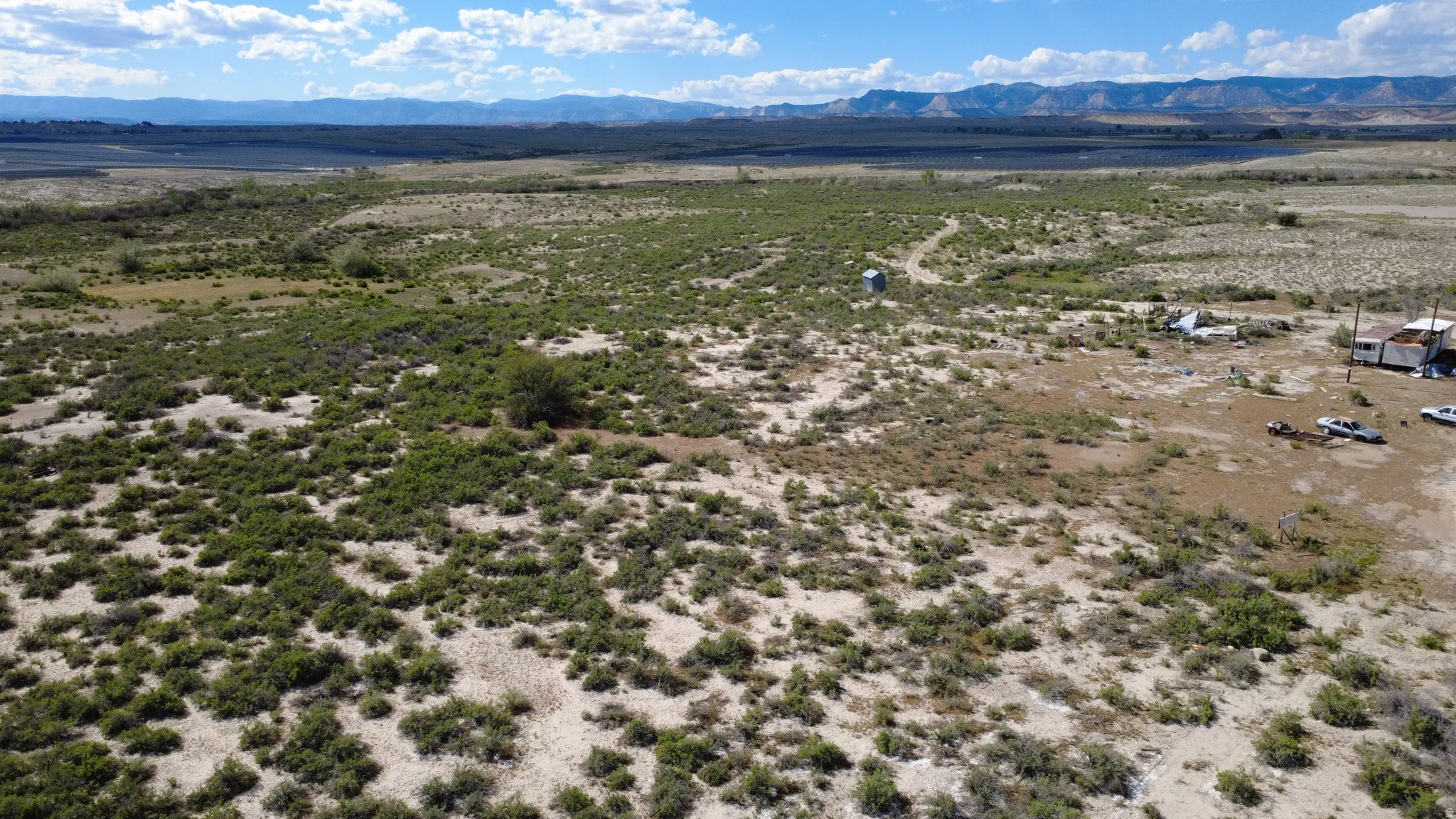Expansive undeveloped terrain featuring diverse desert flora