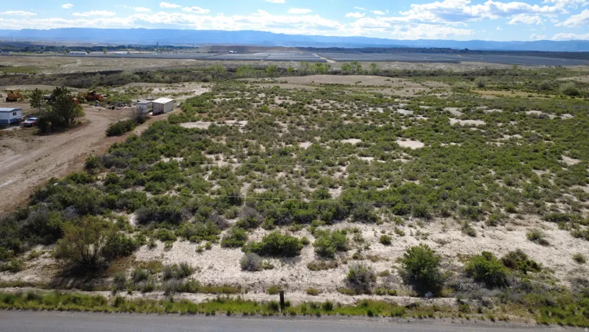 Expansive undeveloped land featuring varied terrain and natural vegetation