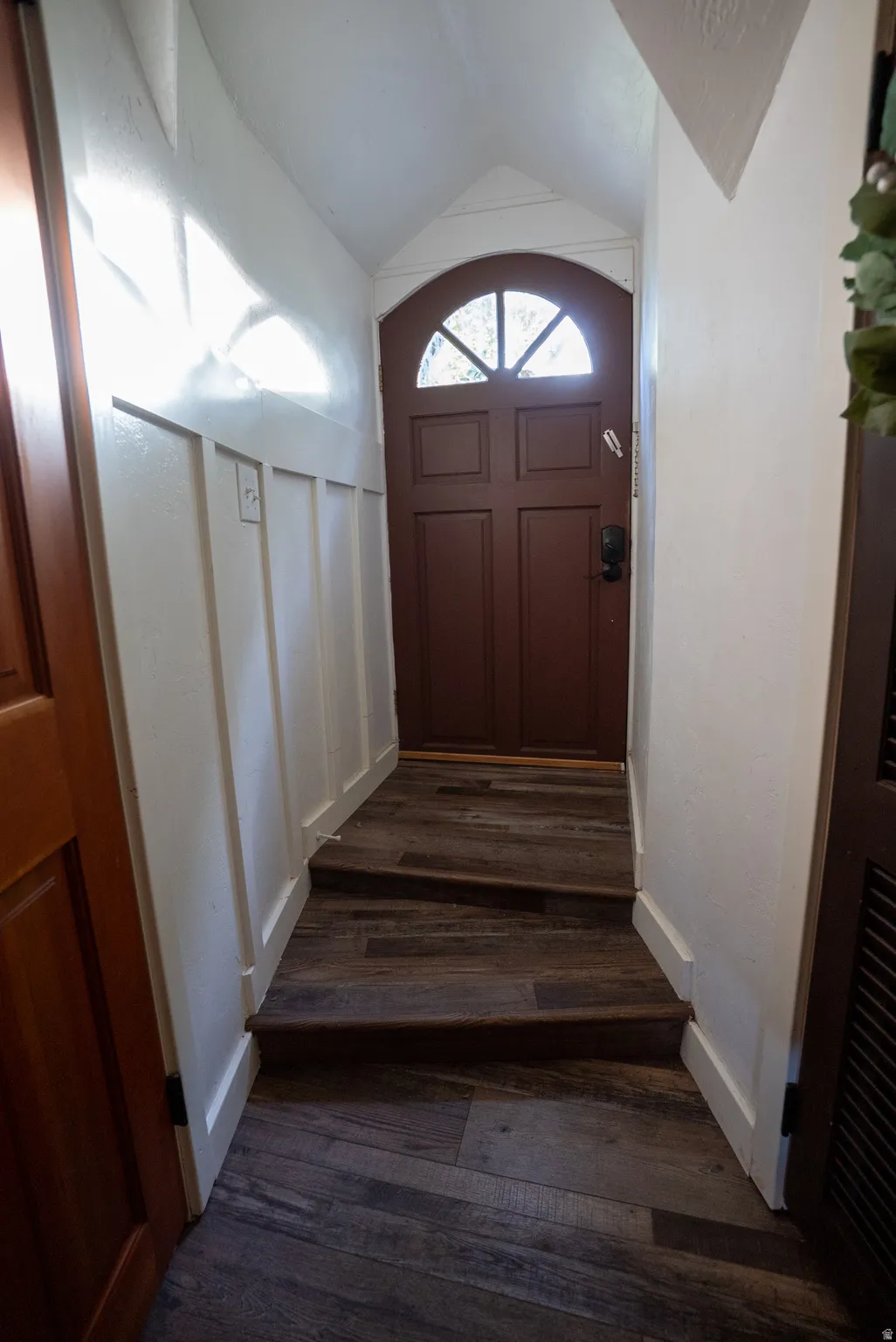 Arch-top entry door with decorative glass