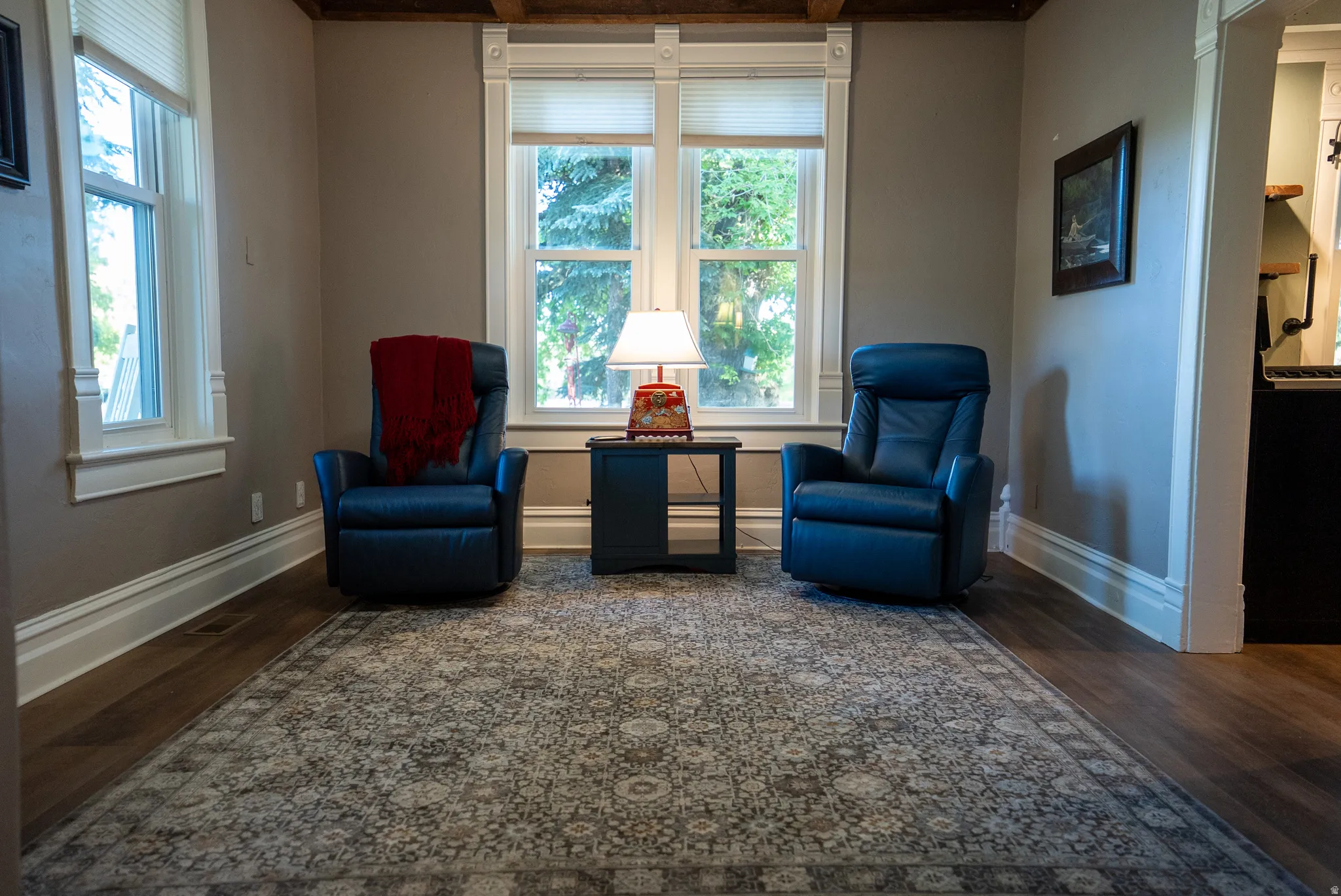 Hardwood-finish flooring complemented by a large area rug