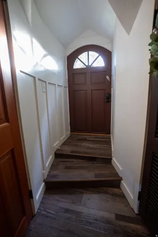 Arch-top entry door with decorative glass