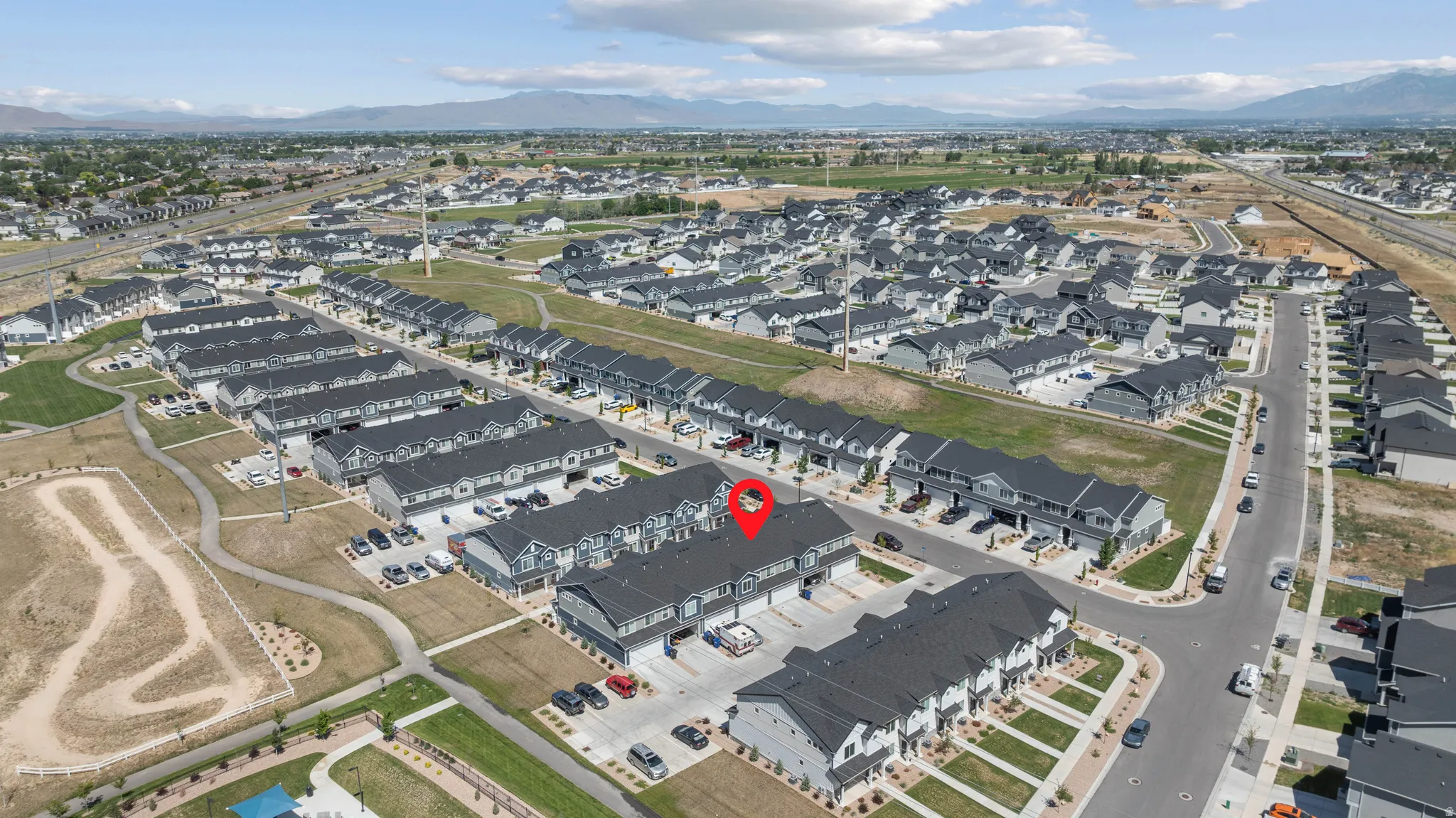 Aerial overview of a residential community with contemporary townhome-style residences