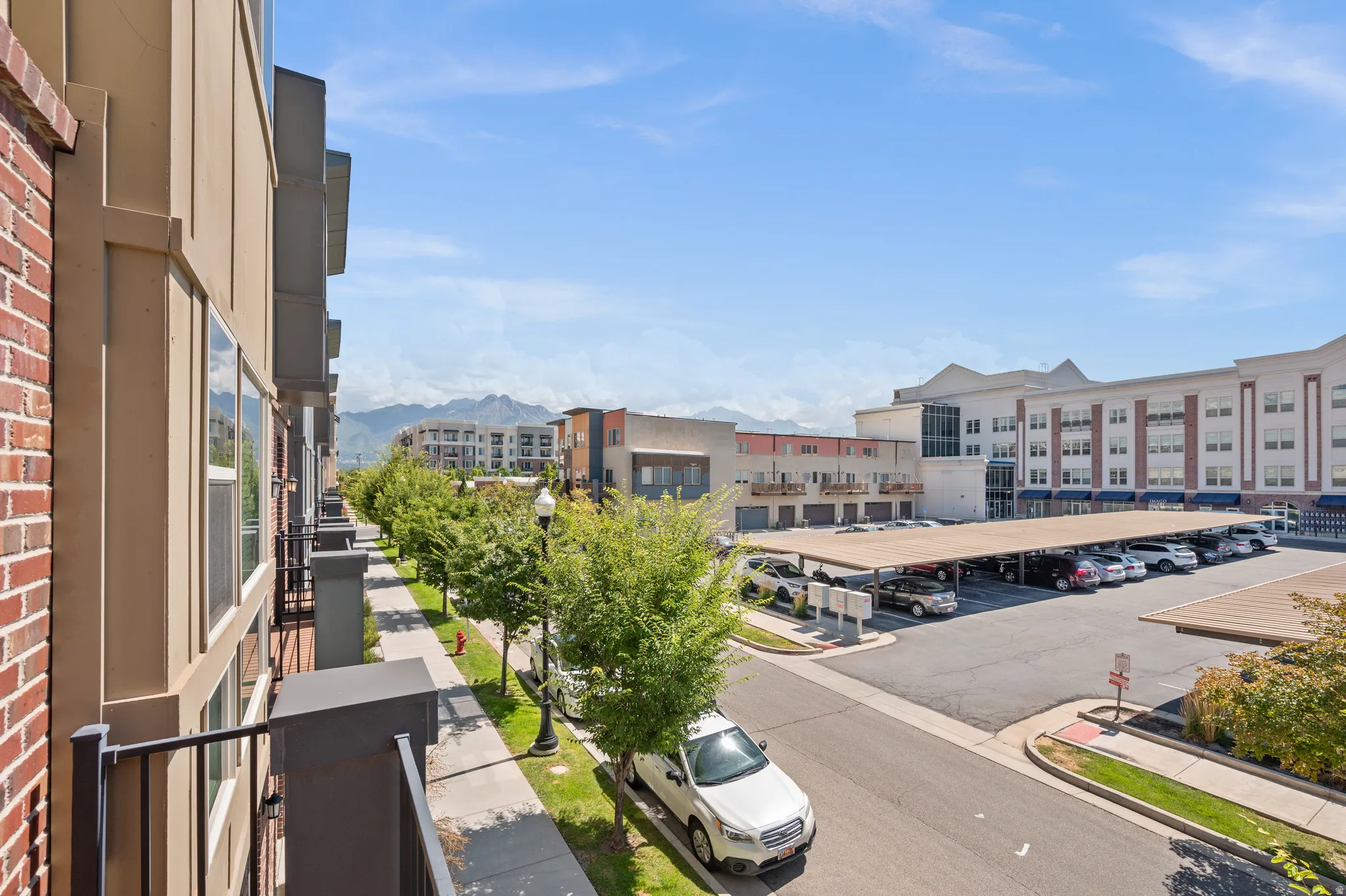 Exterior balcony offering an expansive perspective of the surrounding buildings and infrastructure