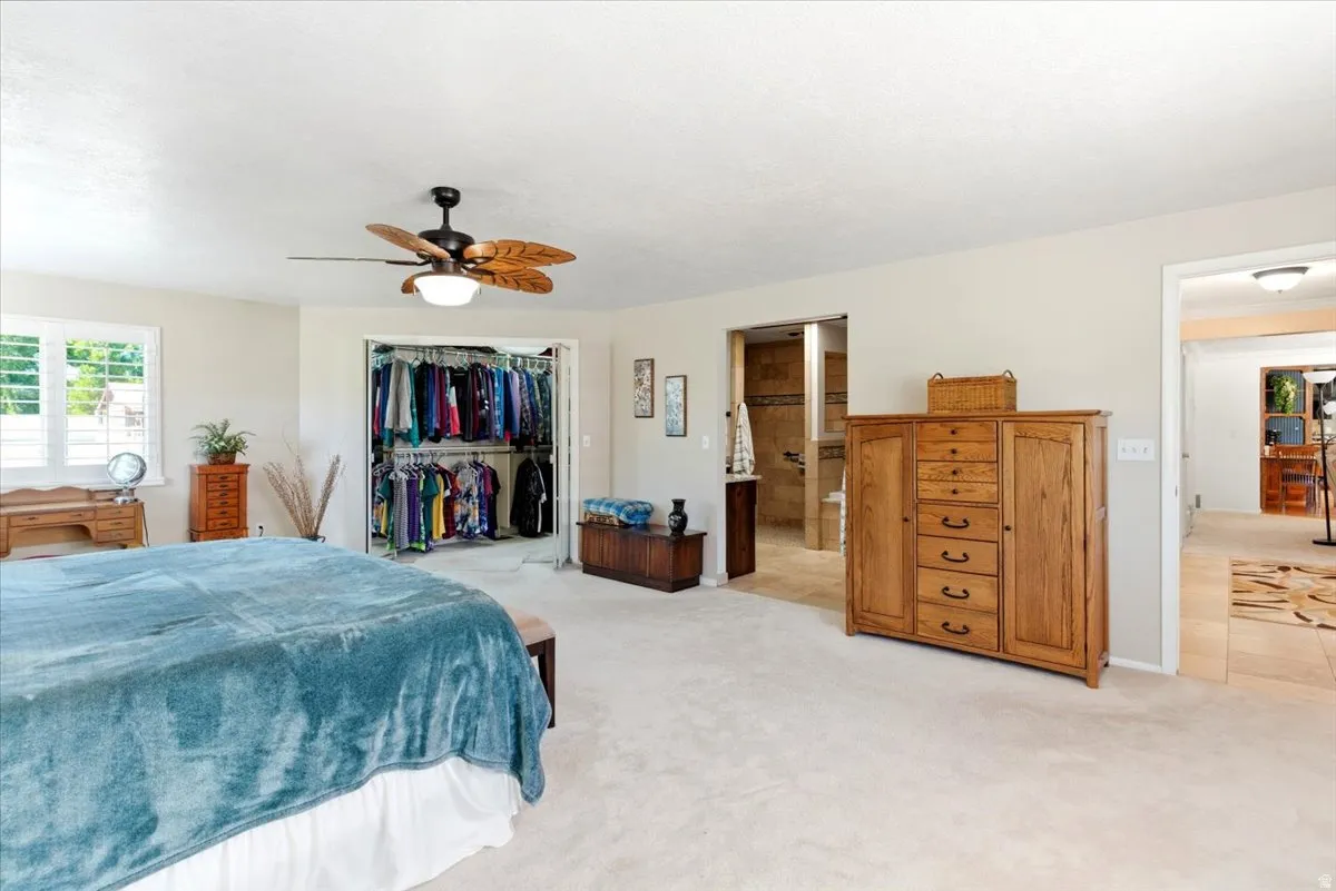 Spacious room featuring light-toned carpeting and neutral wall paint